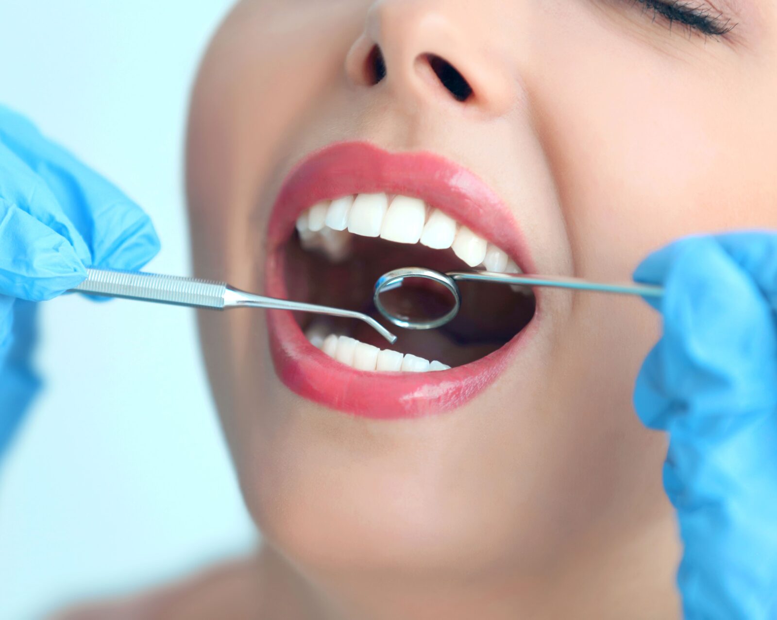 Woman with beautiful smile getting dentist exam